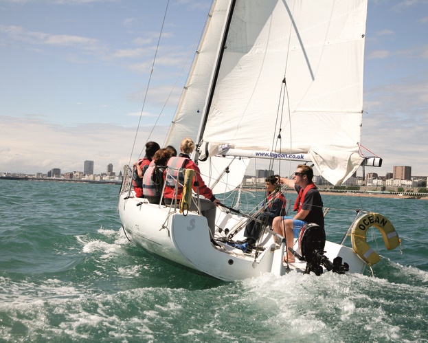 Sailing: shot of yacht with Brighton coast line in background